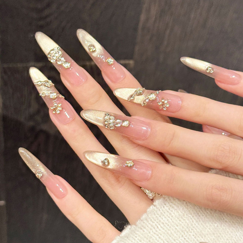 Elegant Christmas press-on nails with peachy-rose gold fade, sparkling tree embellishments & scattered crystals - refined celebration