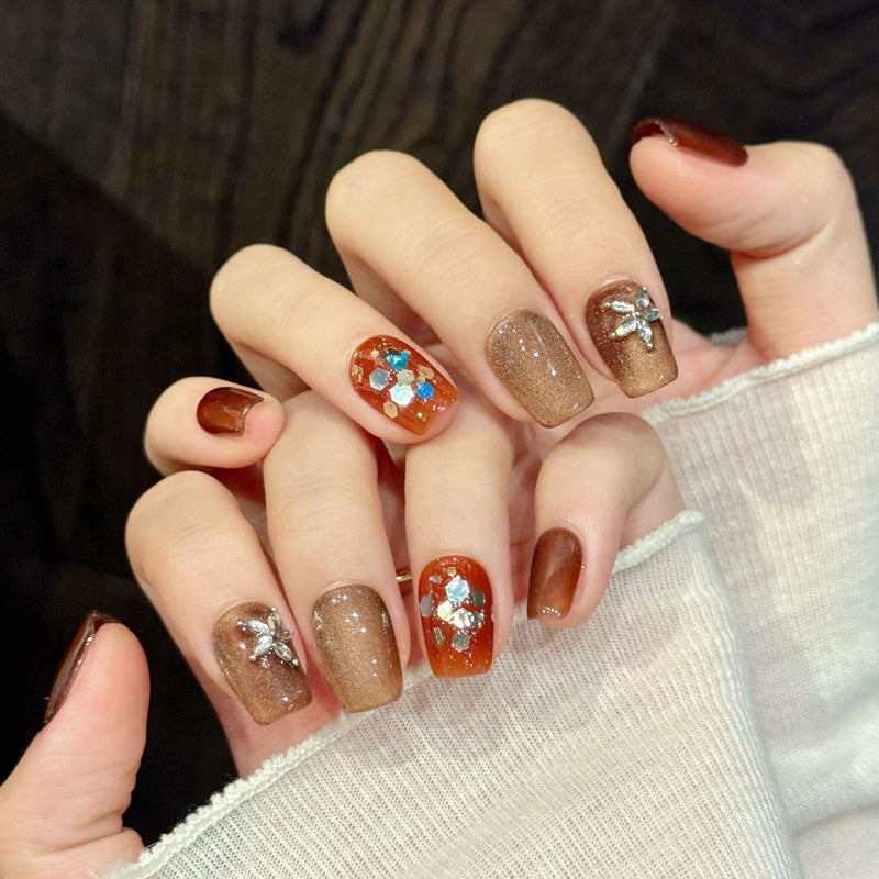 Elegant coffin short nails with silver flower, autumn shimmer, orange accent & crystals - perfect for autumn flower shimmer charm seasonal elegance