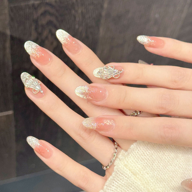 Elegant holiday oval false nails featuring sunset ombré, shimmering sparkle & dimensional tree charms - sophisticated 10-piece set