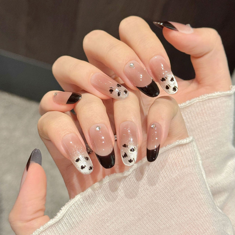 Elegant oval nails with black French tips, silver glitter, crystals & leopard print - perfect for modern French elegance & sophisticated style