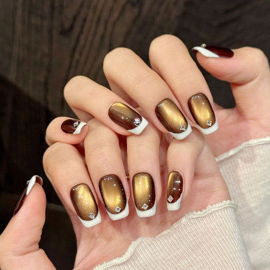 Elegant squoval short nails with brown ombre, crystal accents & white French tips - perfect for brown ombre crystal French tip timeless elegance