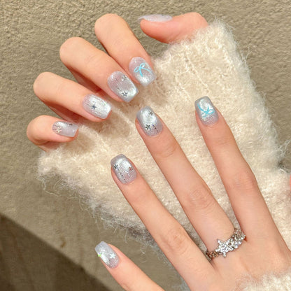 Enchanting squoval short press-on nails with holographic dolphin, iridescent glitter & starfish - perfect for ocean mermaid dreams & beach style
