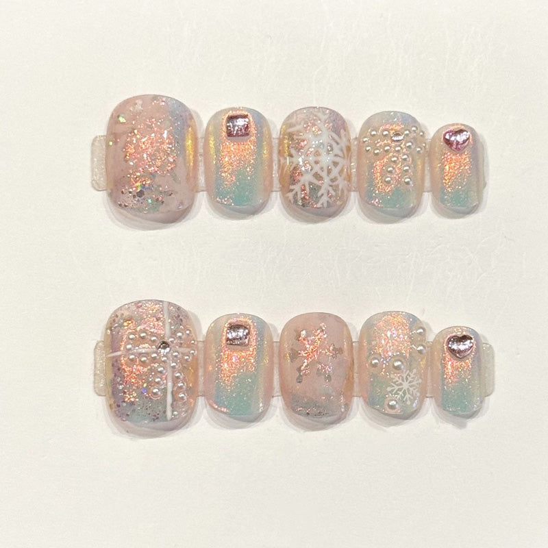Ethereal press-ons with pastel aurora gradients, hand-painted snowflakes & rose gold shimmer - handcrafted winter dream nail art