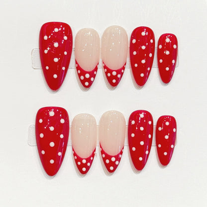 Eye-catching red & white dotted almond false nails featuring sophisticated nude tips - easy-apply festive manicure in minutes