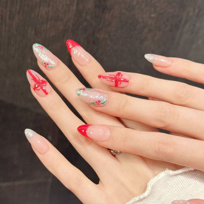 Festive Christmas almond false nails featuring sculpted wreaths, satin bow accents & shimmering sparkle - elegant 10-piece set