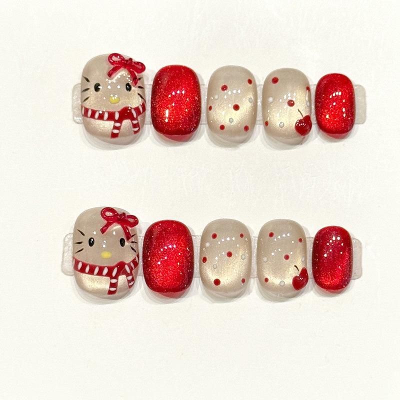 Festive handmade squoval nails with Hello Kitty in winter scarf, red glitter & hearts - Holiday kawaii charm - Applies in 15 minutes
