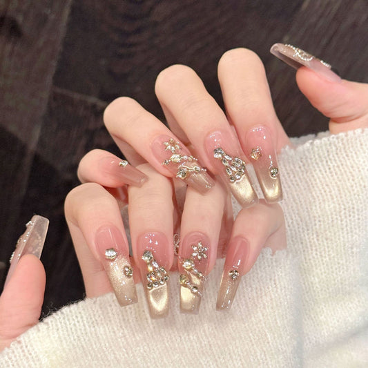 Festive nails featuring warm metallic ombré, dimensional crystal trees & diagonal shimmer lines - sophisticated 10-piece holiday set