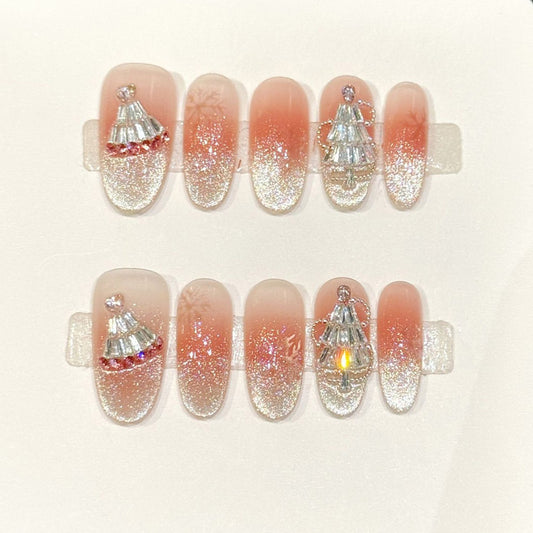 Festive oval press-ons with peachy-coral gradient, cascading silver glitter & 3D Christmas trees - handcrafted holiday nail art