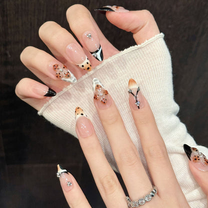 French-inspired almond nails with hand-painted Eiffel Tower, rhinestone hearts & classic tips - sophisticated City of Light collection