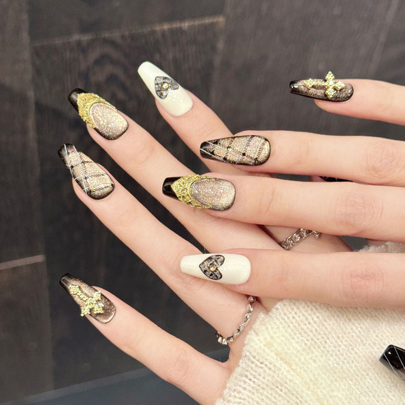 Glamorous coffin nails with champagne-to-black ombré, tactile patterns, sparkling heart & spiritual cross - refined collection