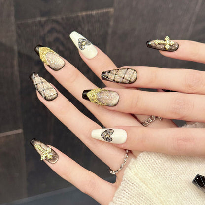 Glamorous coffin nails with champagne-to-black ombré, tactile patterns, sparkling heart & spiritual cross - refined collection