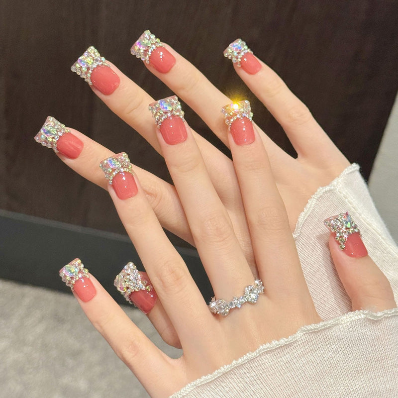 Glamorous duck nails with coral pink gloss, full crystal coverage & AB rhinestones - perfect for coral pink crystal rhinestone luxury glam & bold style
