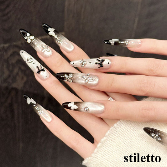 Glamorous nails featuring taupe-to-black ombré, crystal butterflies & white silhouettes - choose oval or stiletto - 10-piece set