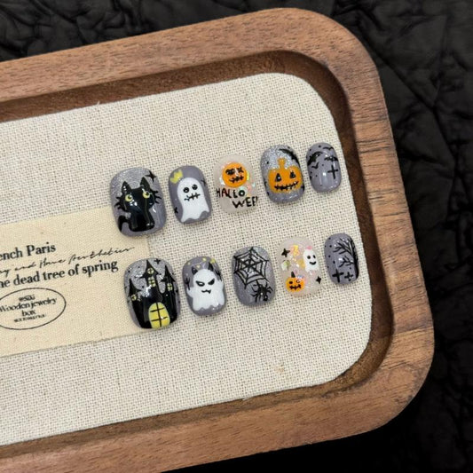 Handcrafted Halloween nails featuring charming ghost characters, jack-o'-lanterns, mystical symbols - oval short shape for cute style
