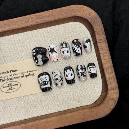Handcrafted Halloween nails featuring kawaii panda faces, ghost characters, crystal embellishments - coffin short shape for cute style