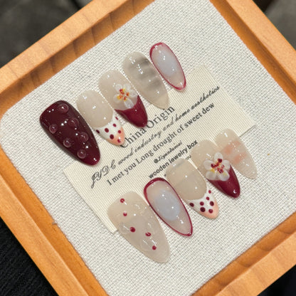 Handcrafted press-on nails with French manicure design and romantic heart details. 2-week wear guaranteed