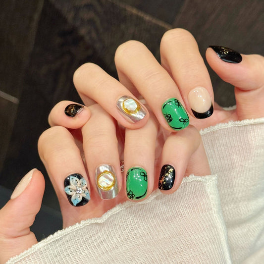 Irish-inspired squoval false nails featuring lucky symbols, vibrant kelly green, chrome finish & starry glitter - 10-piece short set