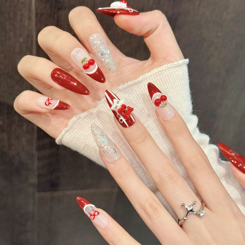 KAPOWNAILS almond nails featuring festive design - adorable cherries, elegant bows, holographic glitter, candy cane stripes, handcrafted quality, 10-piece set