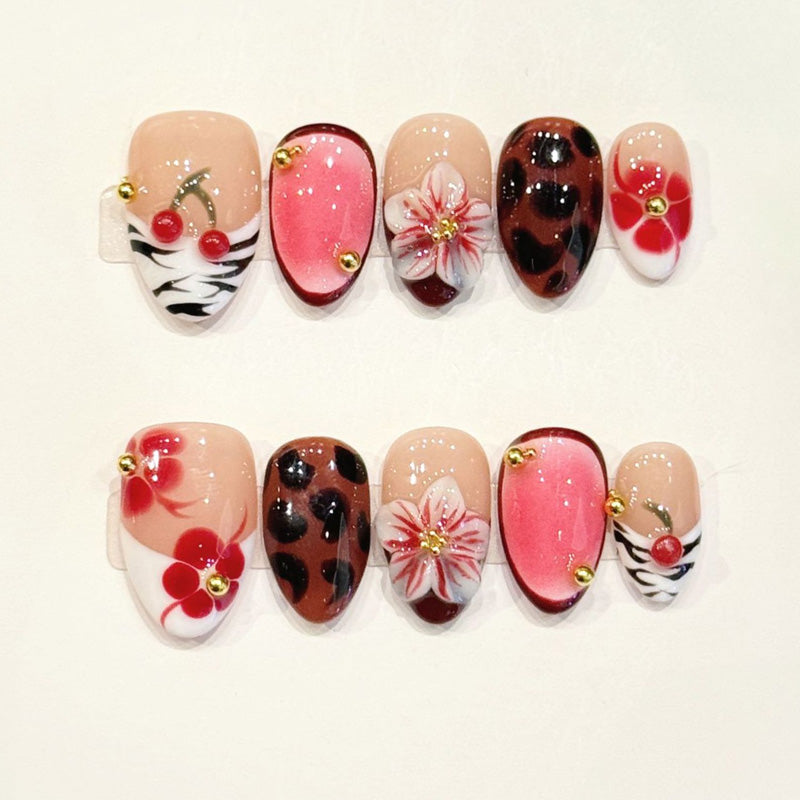 KAPOWNAILS almond nails featuring mixed design - delicate pink flower, leopard spots, zebra stripes, cherry accents, handcrafted quality, 10-piece set
