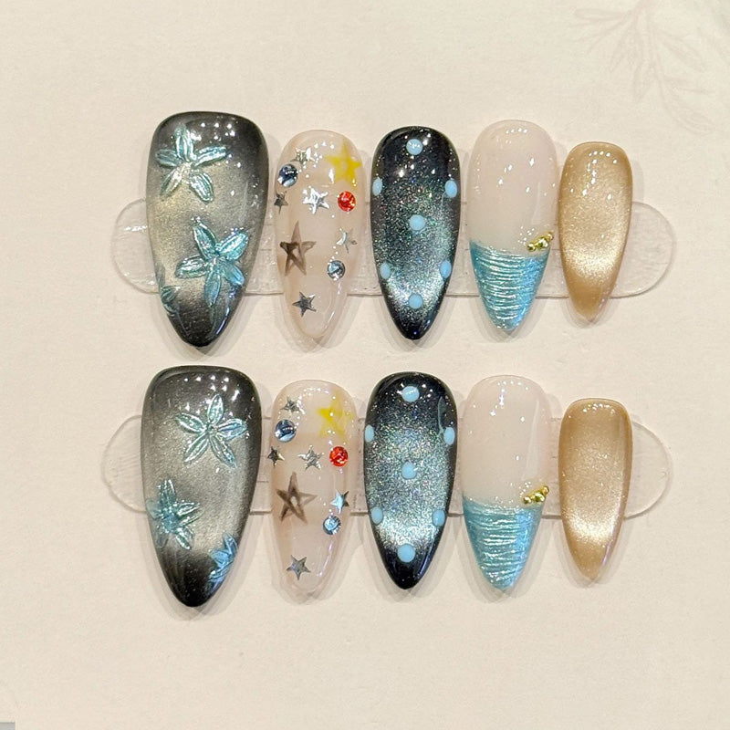 KAPOWNAILS almond nails featuring ocean design - iridescent butterfly, sparkling stars, black-teal gradient, crystal accents, handcrafted quality, 10-piece set