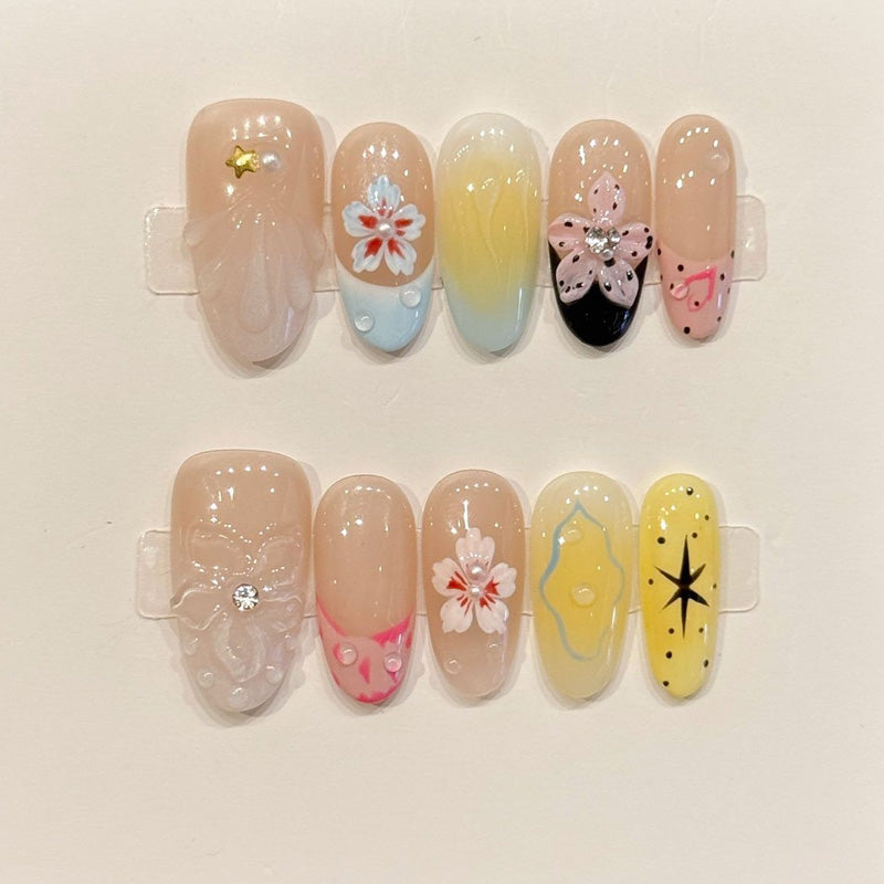 KAPOWNAILS almond nails featuring spring design - delicate flowers, pink butterfly, soft gradients, gold stars, cherry, handcrafted quality, 10-piece set