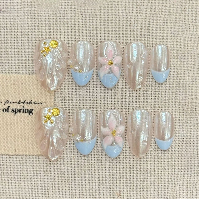 KAPOWNAILS almond nails featuring spring design - delicate pink flowers, white pearls, baby blue tips, gold shell accents, handcrafted quality, 10-piece set