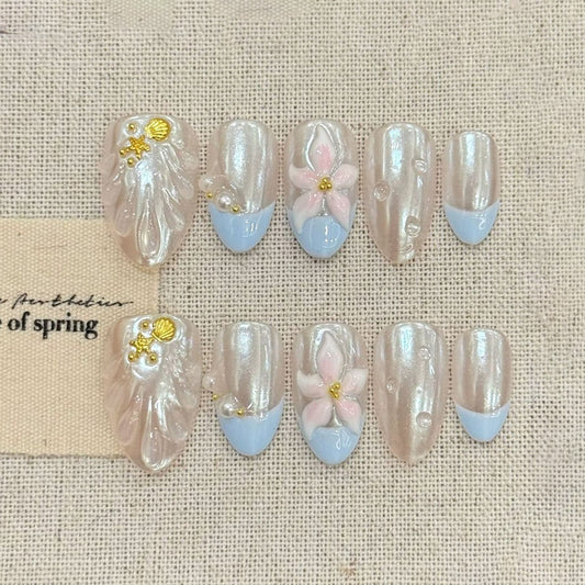KAPOWNAILS almond nails featuring spring design - delicate pink flowers, white pearls, baby blue tips, gold shell accents, handcrafted quality, 10-piece set