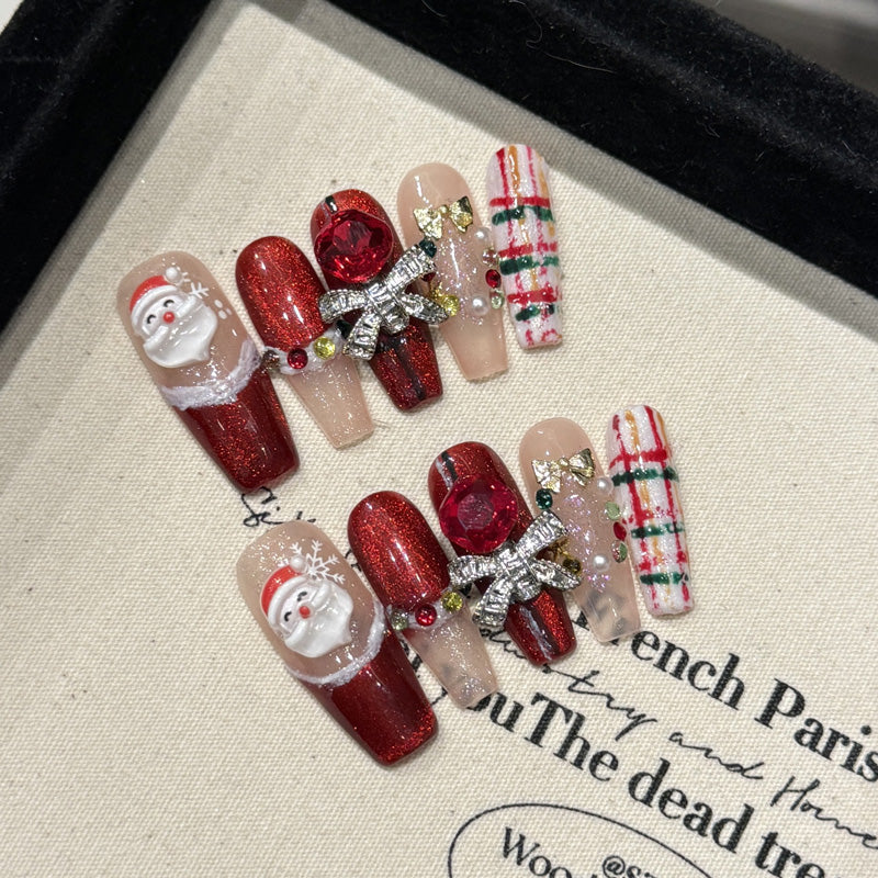 KAPOWNAILS coffin long nails featuring adorable Santa design - 3D Santa face, burgundy sparkle, metallic bow, handcrafted quality, 10-piece set