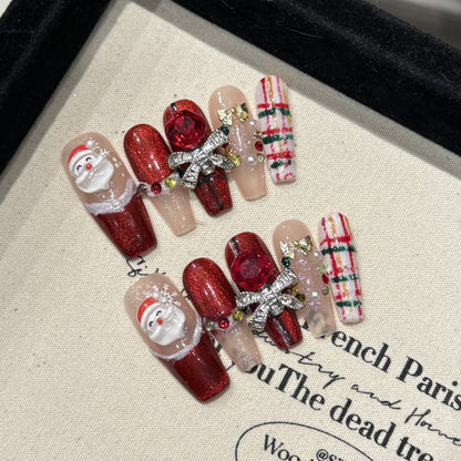 KAPOWNAILS coffin long nails featuring adorable Santa design - 3D Santa face, burgundy sparkle, metallic bow, handcrafted quality, 10-piece set