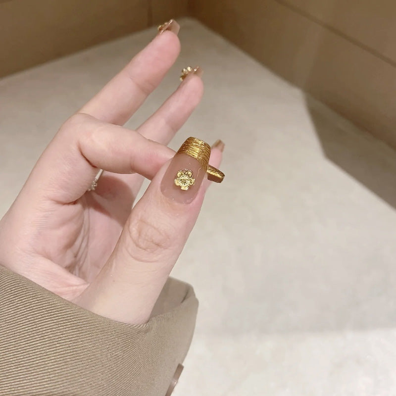 KAPOWNAILS coffin medium nails featuring luxurious gold foil tips & four-leaf clovers - nude base, metallic accents, handcrafted quality, 10-piece set