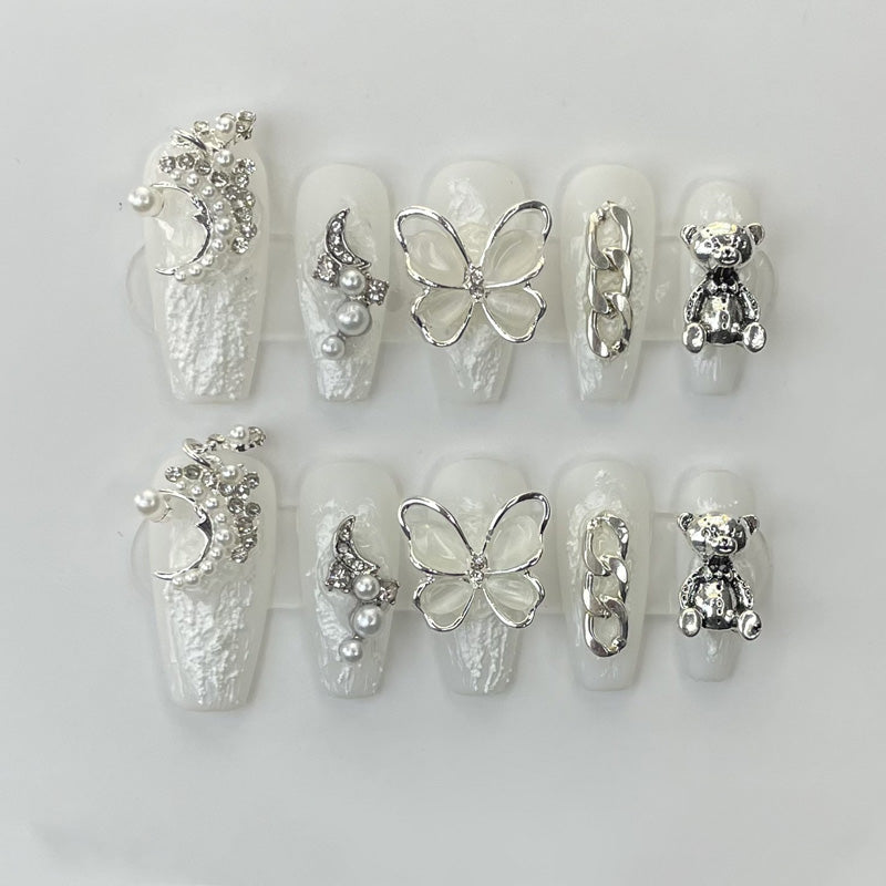 KAPOWNAILS coffin nails featuring sophisticated design - luxurious pearl bow, silver butterfly, adorable bear, chain links, handcrafted quality, 10-piece set