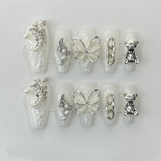 KAPOWNAILS coffin nails featuring sophisticated design - luxurious pearl bow, silver butterfly, adorable bear, chain links, handcrafted quality, 10-piece set