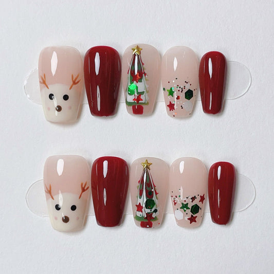 KAPOWNAILS coffin short nails featuring playful Christmas design - cute reindeer face, festive tree, holiday stars, handcrafted quality, 10-piece set