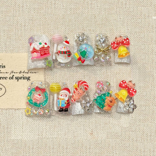 KAPOWNAILS duck nails featuring adorable holiday characters - Santa, snowman, reindeer, gold bells, sparkling glitter, handcrafted quality, 10-piece set