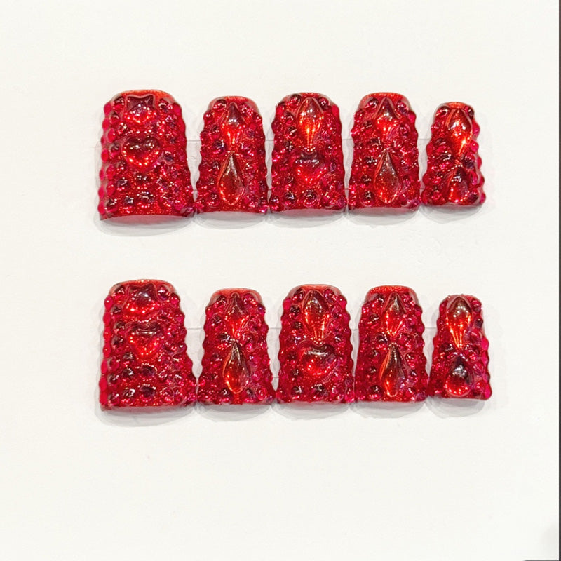 KAPOWNAILS duck nails featuring bold design - deep red gloss, teardrop crystals, sparkling gold glitter, bow accents, rhinestones, handcrafted quality, 10-piece set