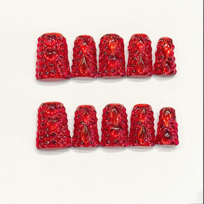 KAPOWNAILS duck nails featuring bold design - deep red gloss, teardrop crystals, sparkling gold glitter, bow accents, rhinestones, handcrafted quality, 10-piece set