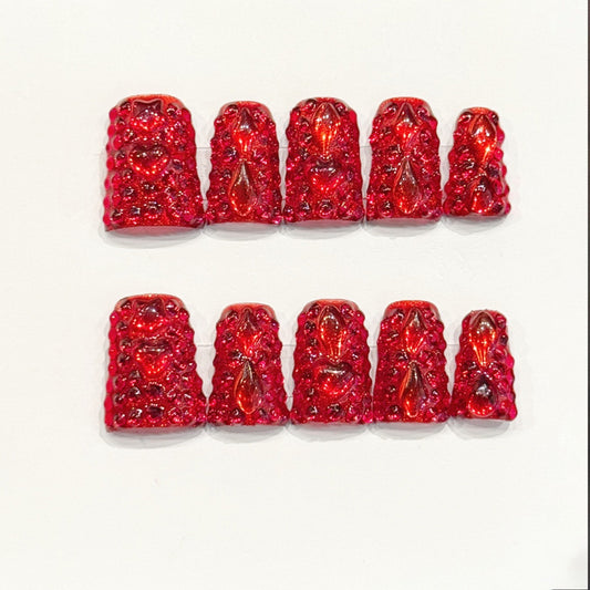 KAPOWNAILS duck nails featuring bold design - deep red gloss, teardrop crystals, sparkling gold glitter, bow accents, rhinestones, handcrafted quality, 10-piece set