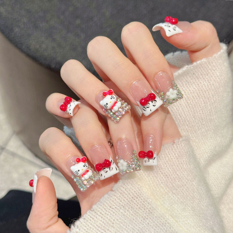 KAPOWNAILS duck nails featuring kawaii design - cute Hello Kitty, vibrant red bows, holographic silver sparkle, handcrafted quality, 10-piece charm set