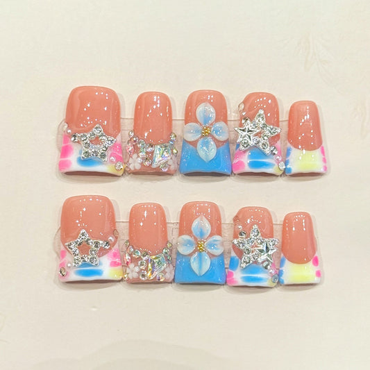 KAPOWNAILS duck nails featuring kawaii unicorn design - 3D silver stars, pearl flower, vibrant rainbow tie-dye, handcrafted quality, 10-piece magical set