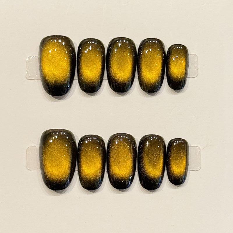 KAPOWNAILS oval nails featuring bold design - vibrant yellow to black ombre, sparkling shimmer, dramatic transitions, handcrafted quality, 10-piece set