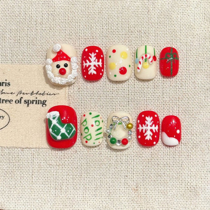 KAPOWNAILS oval nails featuring charming Christmas design - adorable Santa, white snowflakes, playful ornaments, handcrafted quality, 10-piece festive set
