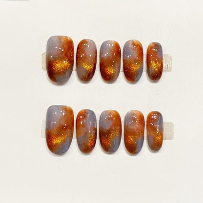 KAPOWNAILS oval nails featuring classic tortoiseshell design - rich amber tones, champagne gold sparkle, glossy finish, handcrafted quality, 10-piece set