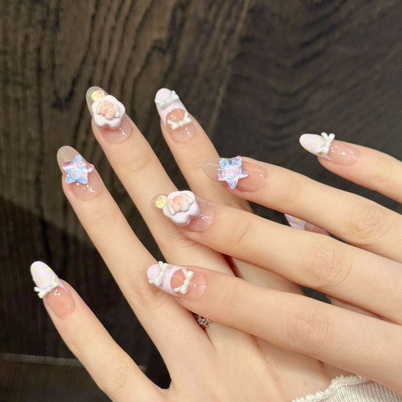 KAPOWNAILS oval nails featuring kawaii design - delicate purple flower, iridescent star, sweet hearts, yellow dots, handcrafted quality, 10-piece set