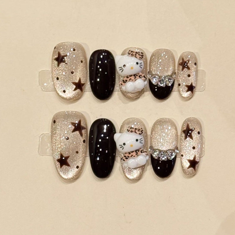 KAPOWNAILS oval nails featuring kawaii design - iconic Hello Kitty, sparkling stars, luxurious silver glitter, black gloss, handcrafted quality, 10-piece set