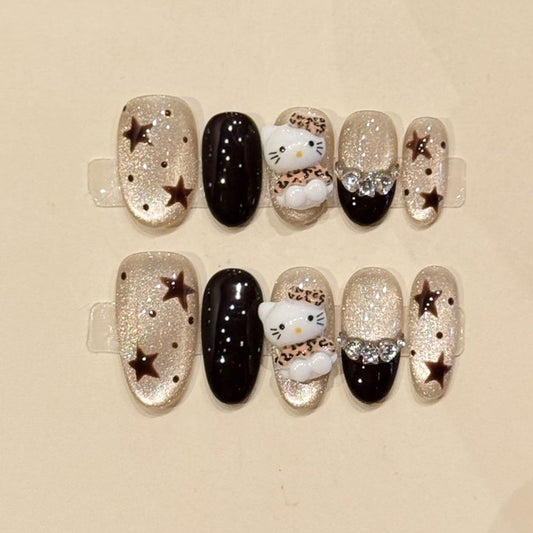 KAPOWNAILS oval nails featuring kawaii design - iconic Hello Kitty, sparkling stars, luxurious silver glitter, black gloss, handcrafted quality, 10-piece set