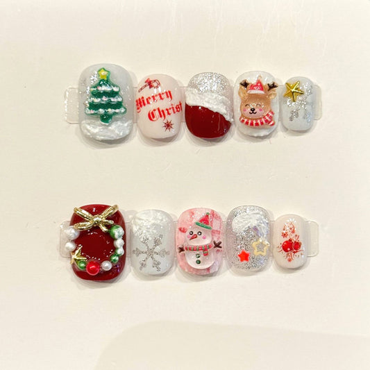 KAPOWNAILS squoval short nails featuring Christmas design - green tree, pink snowman, cute reindeer, festive text, handcrafted quality, 10-piece festive set