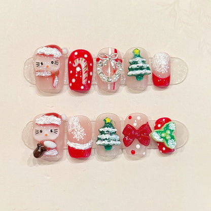 KAPOWNAILS squoval short nails featuring kawaii Christmas design - Hello Kitty Santa, festive tree, silver bow, handcrafted quality, 10-piece festive set