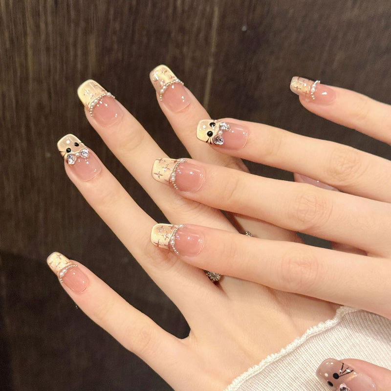 KAPOWNAILS squoval short nails featuring sweet kawaii design - bunny faces, sparkling bows, gold crosses, pearl chains, handcrafted quality, 10-piece set