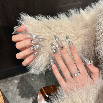 KAPOWNAILS stiletto long nails featuring bridal elegance - soft nude tones, shimmering silver foil, sparkling crystals, 10-piece luxury set