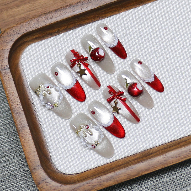 KAPOWNAILS stiletto long nails featuring festive Christmas design - red-white gradient, 3D silver wreaths, gold stars, handcrafted quality, 10-piece set